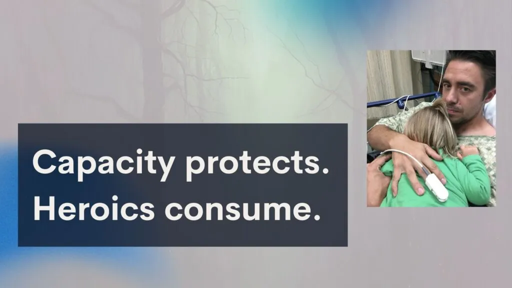Author in a hospital gown sitting in an ER bed, holding his young daughter against his chest, showing the personal cost of disaster deployment and illness.