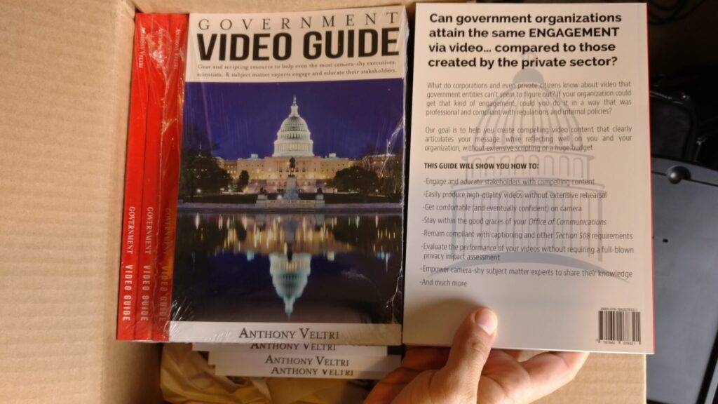 A hand holds a copy of the 