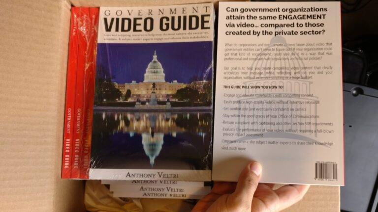 A hand holds a copy of the 