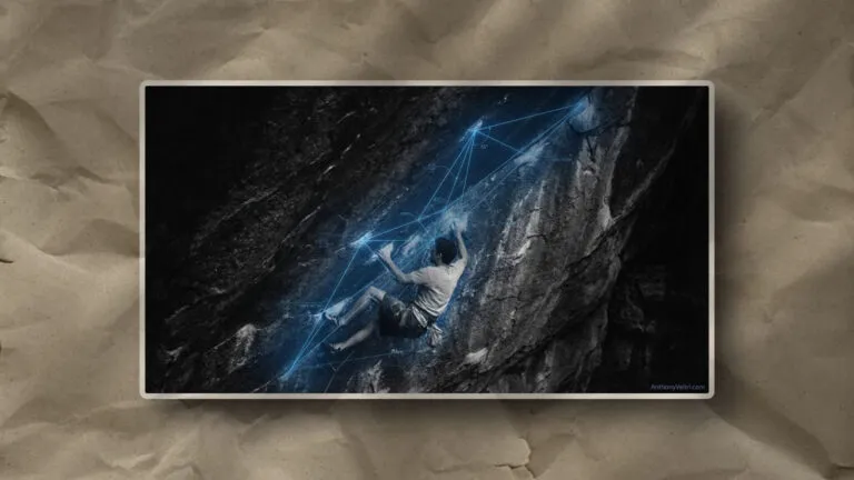 This image illustrates a climber’s path, as highlighted by digital lines mapping key contours along a steep, dark rock face.