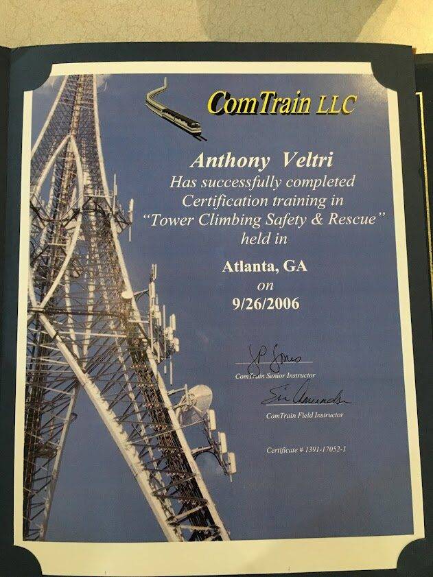 A certificate awarded to Anthony Veltri for completing "Tower Climbing Safety & Rescue" training from ComTrain LLC in Atlanta, GA on 9/26/2006, featuring an image of a telecommunications tower.