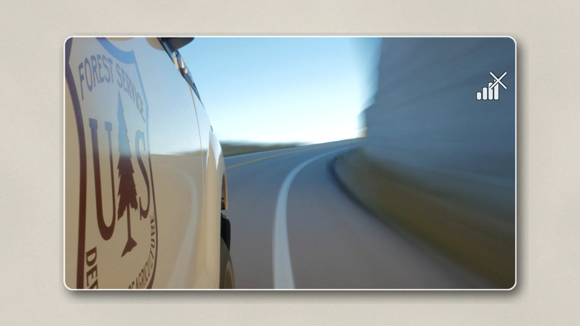 This image illustrates the challenge of limited connectivity, as seen by a U.S. Forest Service vehicle in a remote, low-signal area.