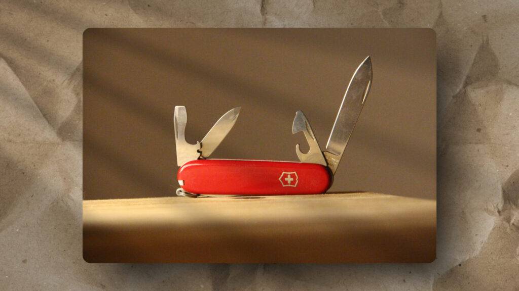 This image illustrates a red Swiss Army knife with key tools extended, emphasizing adaptability and functionality in diverse contexts.