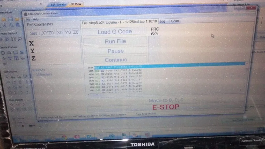 A computer screen displays CNC Shark Control Panel software with a list of G-code commands. The "Load G Code" and "Run File" buttons are visible. "E-STOP" is highlighted in red, and the software interface shows part coordinates and file information.